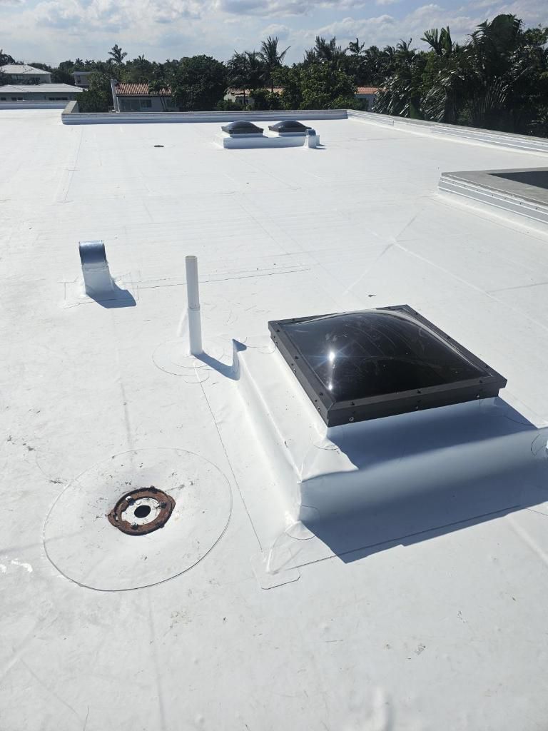 TPO roof with tapered insulation and skylights