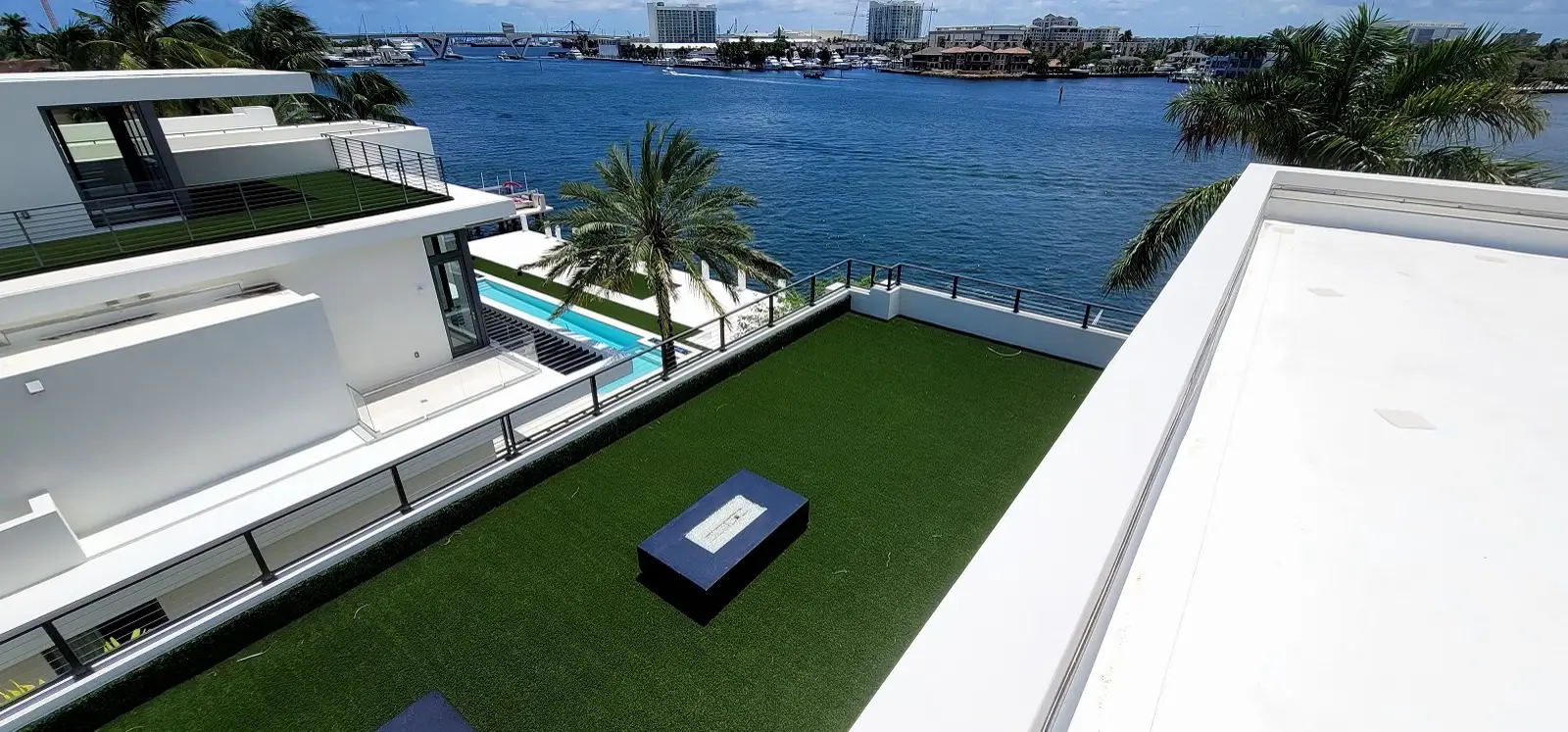 Completed residential low-slope TPO roof patio extension