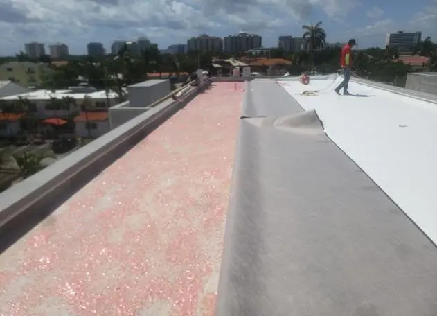 TPO roofing installation in progress, showing the application process on a commercial roof.