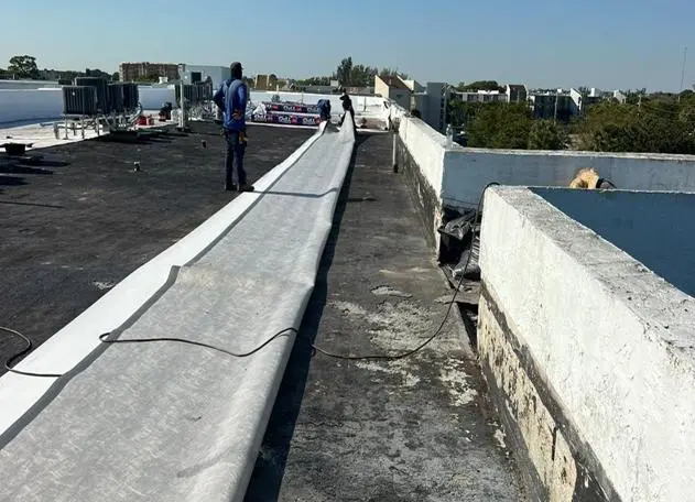 TPO roofing installation on a commercial property in Lake Worth for effective waterproofing.