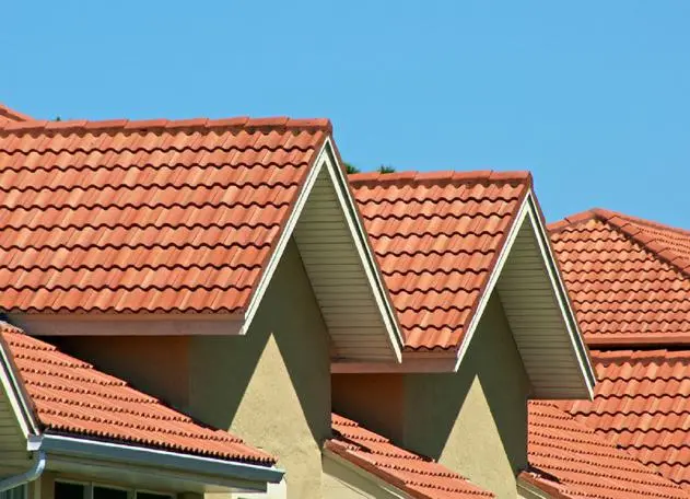 Tile roofing installation by a professional contractor, showcasing expert craftsmanship and quality materials.