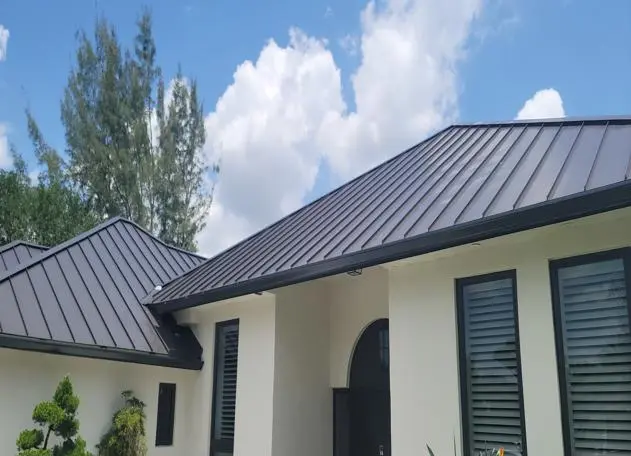 sleek looking metal roof installed by planet roofing crew