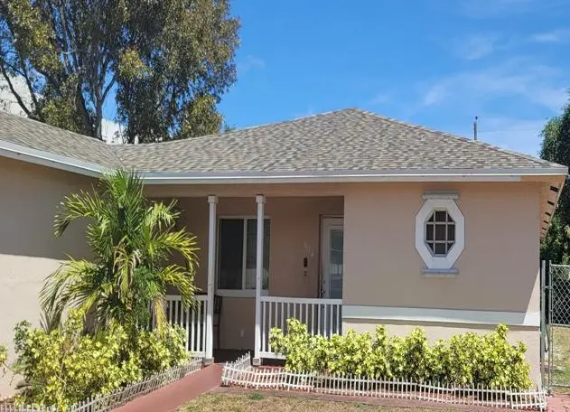 Shingle roof on a residential building, showcasing the layered shingles and roof structure.