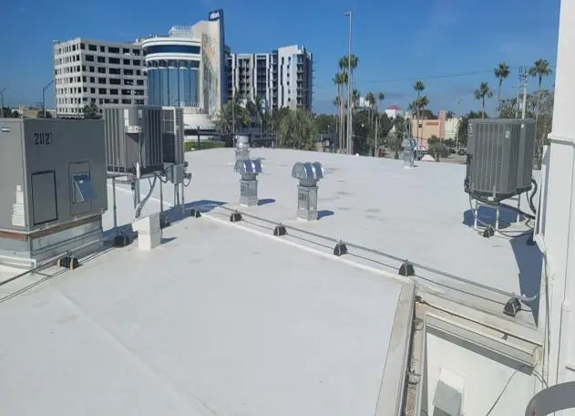 TPO roofing installed on a commercial building by Planet Roofing, showcasing a completed, weather-resistant system.