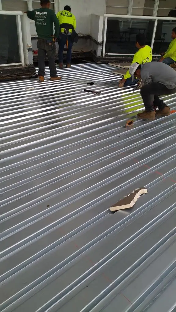 Fort Lauderdale commercial roofing company installing energy-efficient metal roof