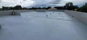 Flat concrete roof deck installation for a low-slope roof
