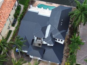 Comparison of a roof with missing shingles next to a newly installed roof in Fort Lauderdale